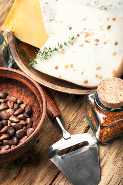 Swiss cheese with pine nuts - Photo, Image