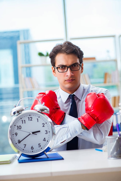 Businessman with boxing gloves in the office - Photo, Image