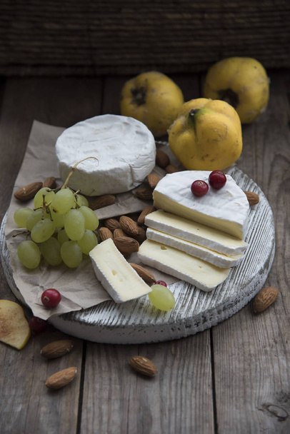 camembert cheese, fruits and nuts  - Photo, Image