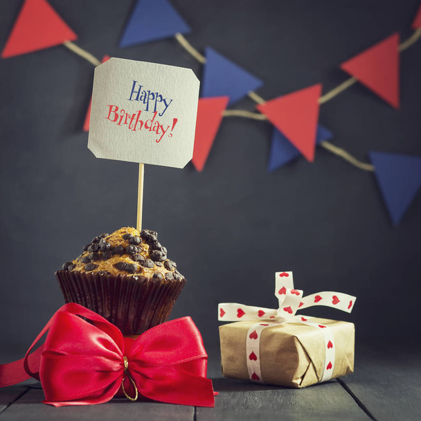 Birthday cupcake on a dark background. Happy Birthday. Postcard. Congratulations. - Photo, Image