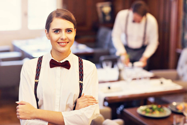 Waiters standing in restaurant - Foto, imagen