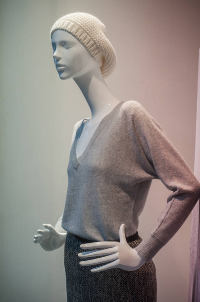 wool hat and pullover on mannequin in fashion store  - Фото, зображення
