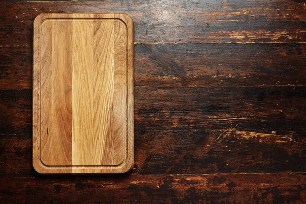 cutting board on a wooden background - Foto, imagen