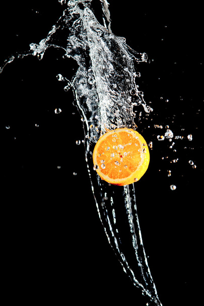Orange and waters splashes - Fotoğraf, Görsel