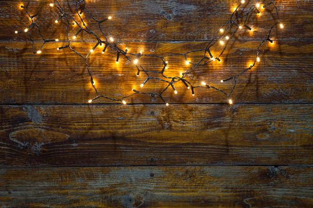 Luci di Natale su sfondo di legno - Foto, immagini