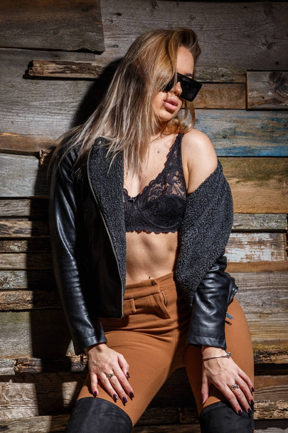 stylish girl in bra, jacket and sunglasses - Foto, Imagem