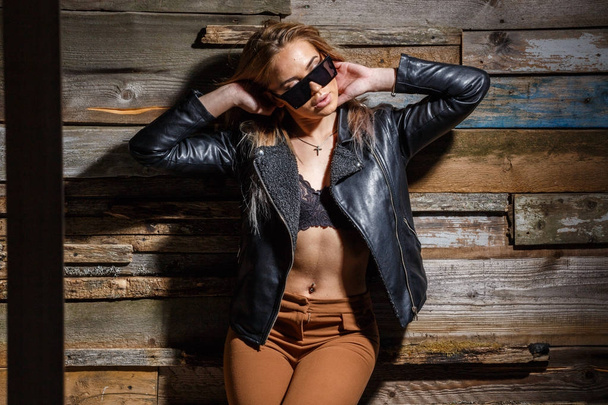 stylish girl in bra, jacket and sunglasses - 写真・画像