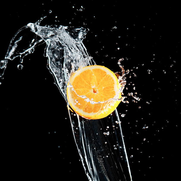 Orange and waters splashes - 写真・画像