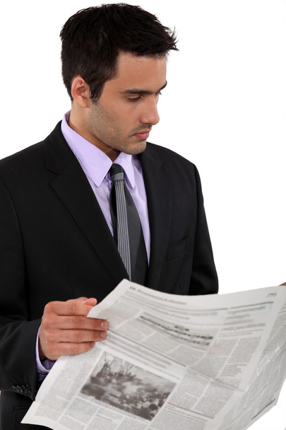 Businessman reading a newspaper - Foto, afbeelding