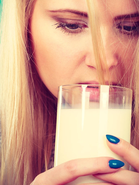 Woman drinking milk from glass - Фото, изображение