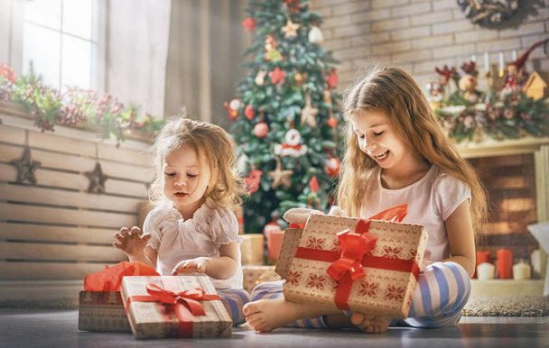 girls opening gifts - Photo, image
