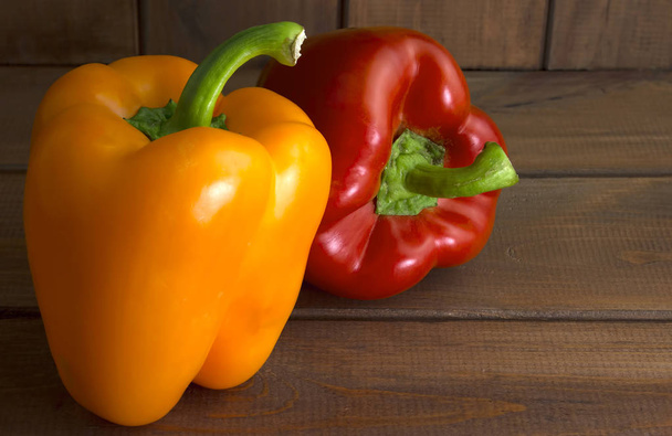 Juicy beautiful Bulgarian pepper on a wooden background - Photo, Image