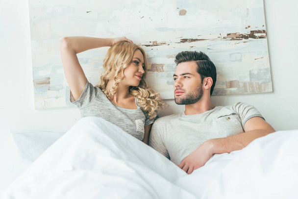 young couple in bed  - Photo, Image