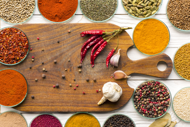  wooden board and colorful spices - Foto, imagen
