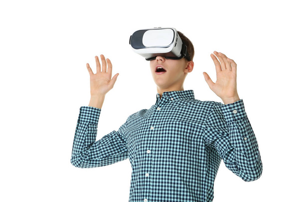Young boy in virtual reality goggles on white background - Photo, Image