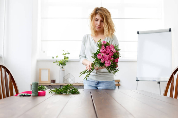 Photo of florist woman making bouquet - Photo, Image