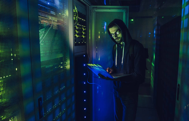 Hacker in data centre - Fotó, kép