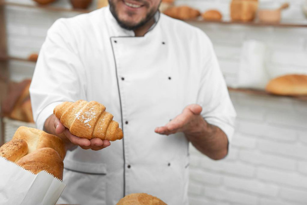Professional baker at his store - Fotó, kép