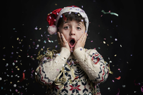 surprised child in New Year 's Eve
  - Фото, изображение