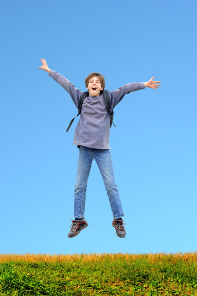 Teenager jumping - Фото, изображение