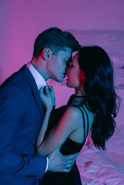 couple kissing in dark room - Photo, Image