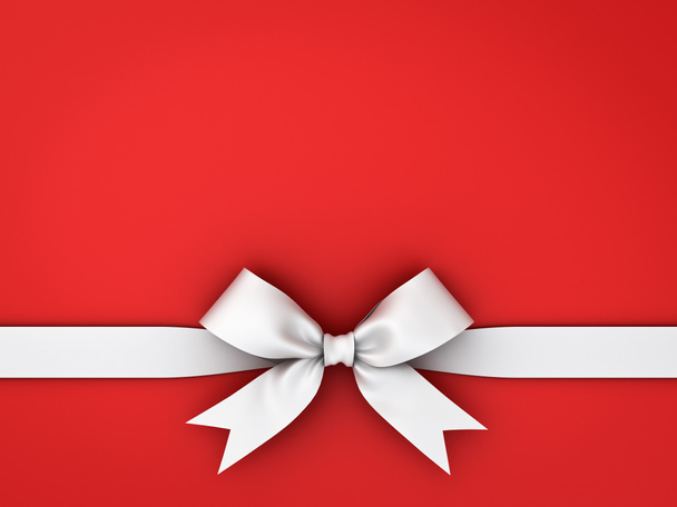White gift ribbon bow isolated on red background - Photo, Image