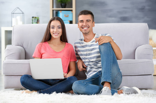 Young couple with laptop - Fotó, kép