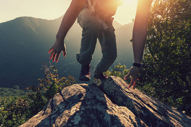one woman hiker climbing on mountain top - Фото, зображення