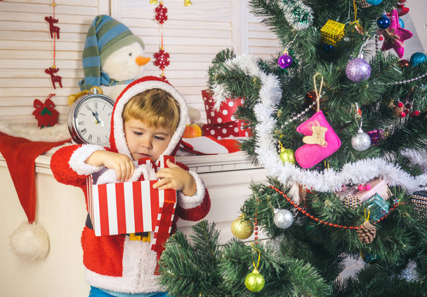 New year small boy at decoration toy. - Fotografie, Obrázek