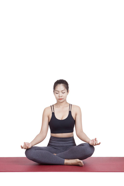 Portrait of young asian woman exercise playing yoga isolated whi - Foto, Imagem