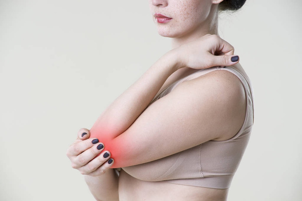 Woman with pain in elbow, joint inflammation - Foto, afbeelding