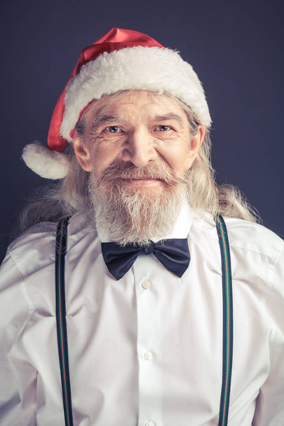 Office Santa Claus wearing white shirt and bow tie. - 写真・画像