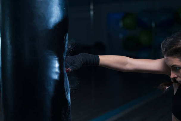 fighter boxer fit girl wearing hand bandage in training with hea - Fotoğraf, Görsel