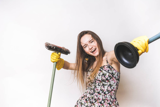 Emotional happy cleaning woman with mop and plunger - Φωτογραφία, εικόνα