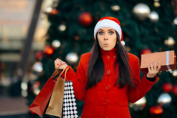 Christmas Shopping Girl with Bags and Gift Box - Foto, afbeelding