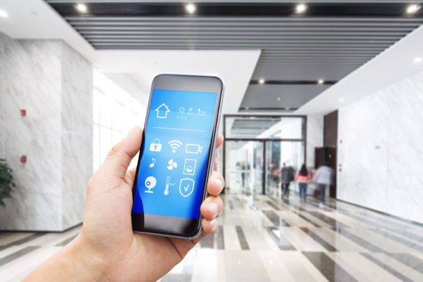 smartphone in modern spacious hall - Photo, Image