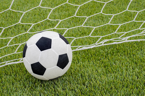 The soccer football with the net on the artificial green grass soccer field  - Foto, Bild