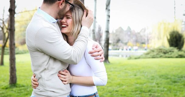 Loving couple hugging in park - Valokuva, kuva