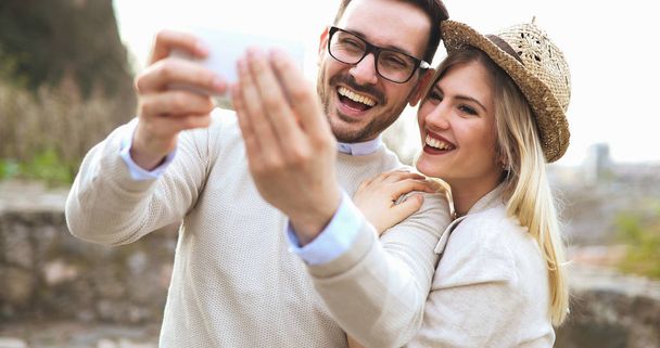 couple having fun and taking a selfie - Photo, image