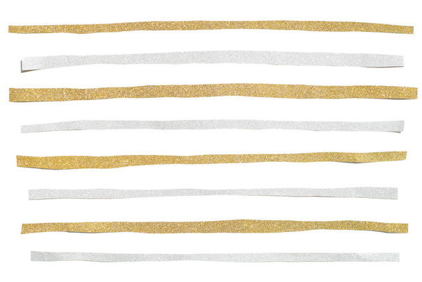 Золотой и серебряный блеск полосатая бумага разрезанная на белом фоне
 - Фото, изображение