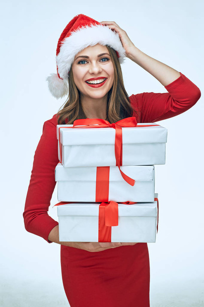 Smiling santa girl in Christmas style holding gift box.  - Fotó, kép