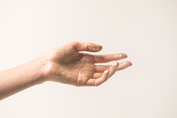 ženská ruka v zlaté třpytky - Fotografie, Obrázek