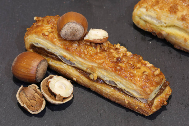 tasty pastry with hazelnuts and cream - Photo, Image