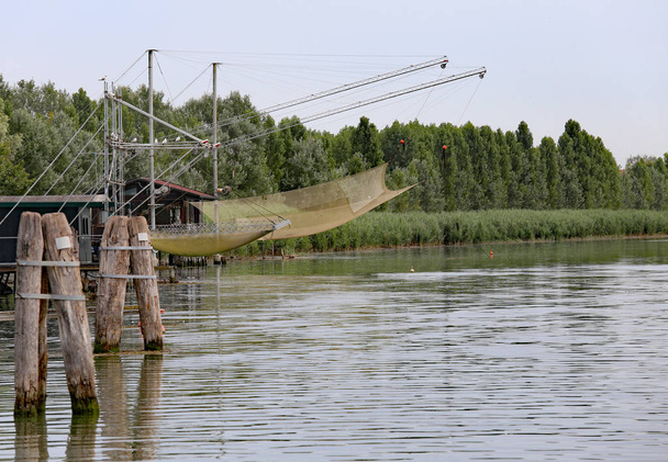 stilts houses with fishing nets for fishing on the river - Photo, Image