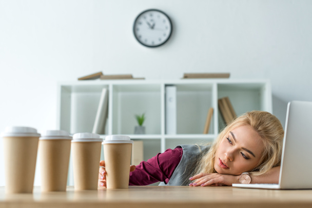 Tired businesswoman lying on table - Photo, Image