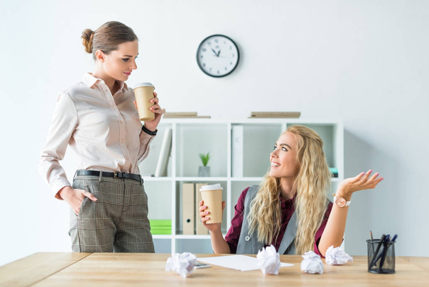 female colleagues drinking coffee - Photo, Image