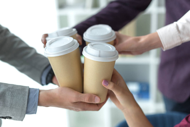 business partners clinking coffee cups - Photo, Image