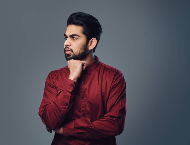 An Indian male dressed in a red shirt  - Photo, Image