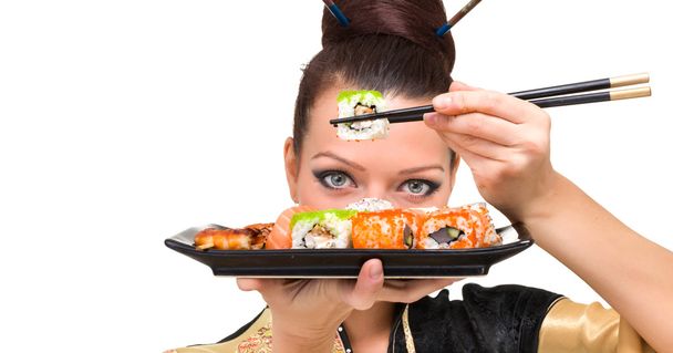 Close up portrait of young woman with sushi - Фото, зображення