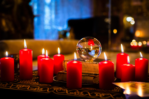 Crystal ball in the candle light to prophesy - Photo, Image